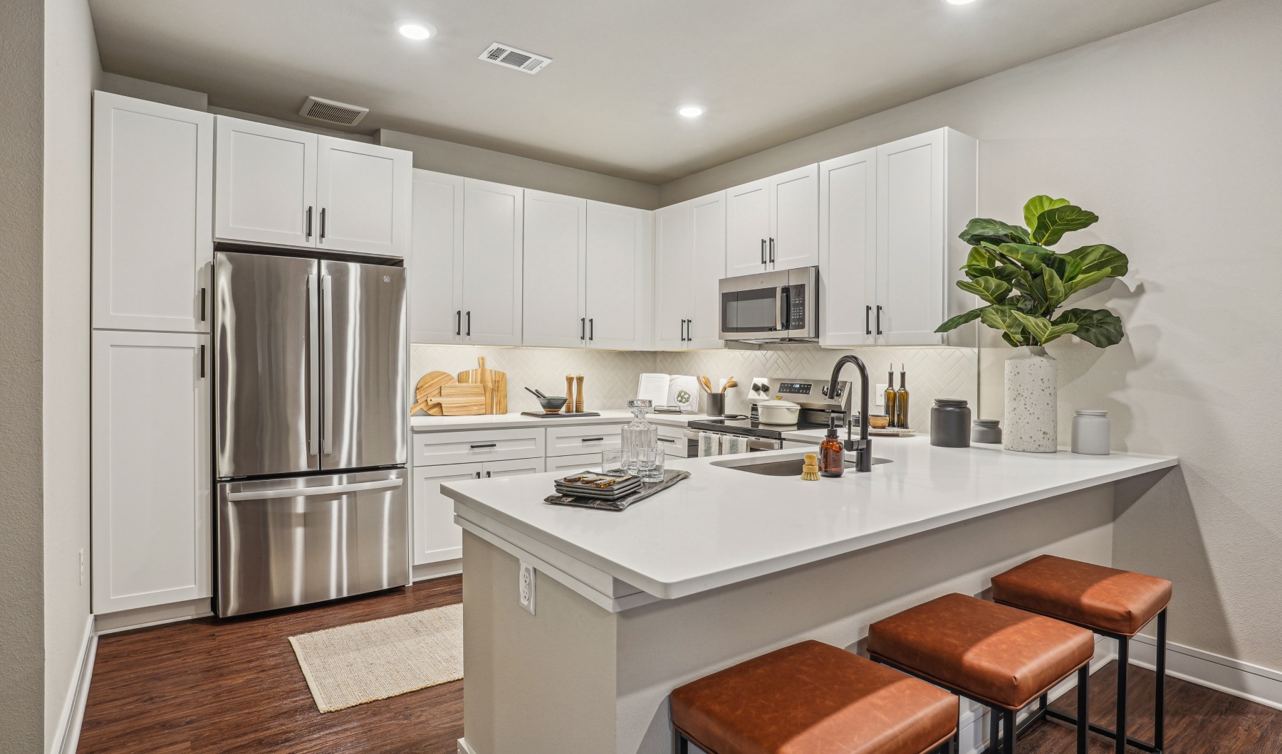 Kitchen with stainless steel appliances and quartz countertops